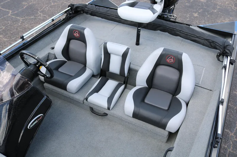 Slide: The Image of 2020 Alumacraft Pro 185 boat interior with gray and black seating. - 22