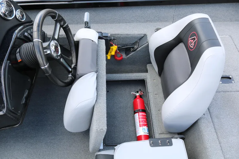 Slide: The Image of 2020 Alumacraft Pro 185 boat interior with steering wheel, seats, and fire extinguisher. - 24