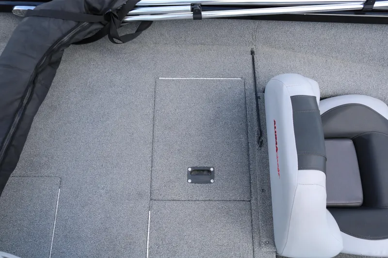 Slide: The Image of 2020 Alumacraft Pro 185 boat interior with gray carpet and cushioned seat. - 29