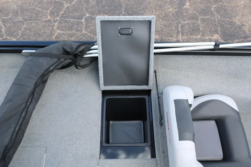 Slide: The Image of 2020 Alumacraft Pro 185 boat interior with open storage compartment and seating. - 30