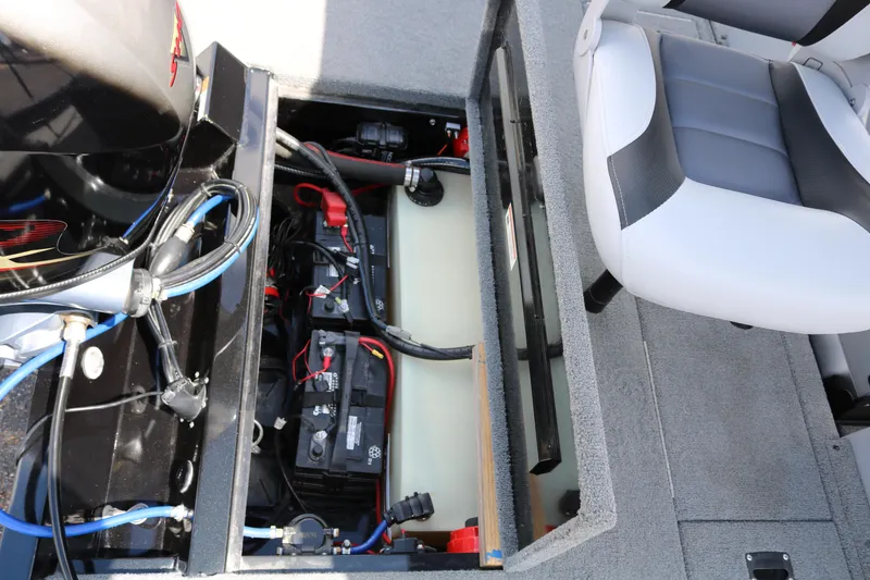 Slide: The Image of 2020 Alumacraft Pro 185 boat interior showing battery compartment and seating. - 34