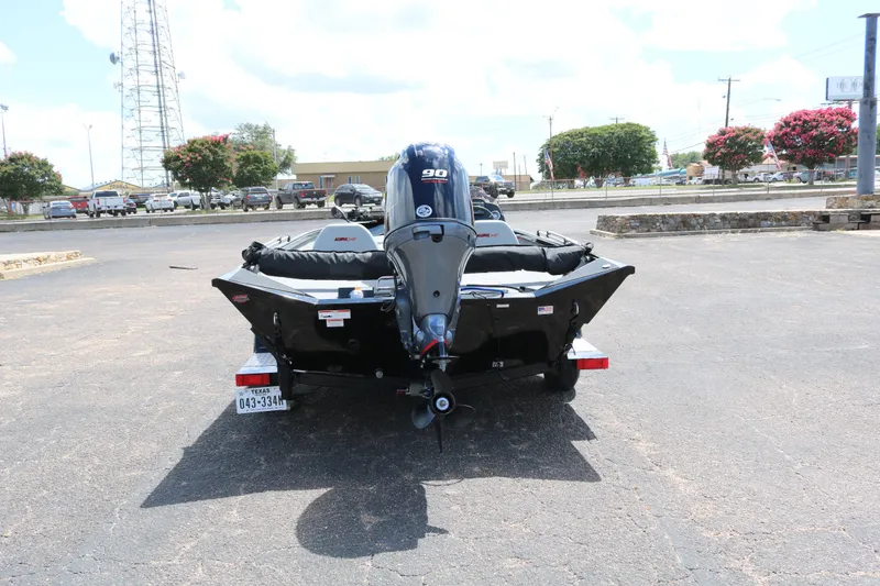 Slide: The Image of 2020 Alumacraft Pro 185 boat with outboard motor in a parking lot. - 6