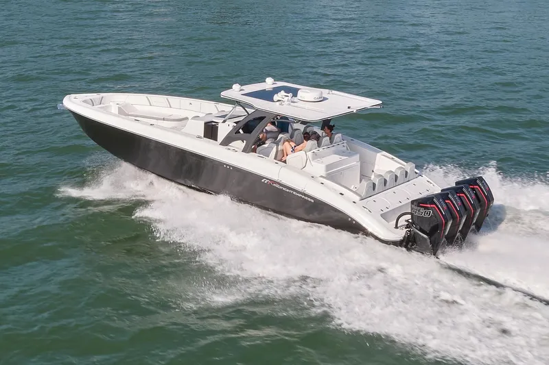 The Image of 2021 Midnight Express 43' Open boat cruising on water with multiple outboard engines. - 0