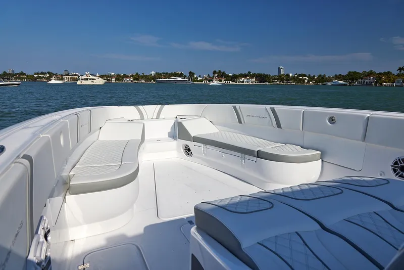Slide: The Image of 2021 Midnight Express 43' Open boat interior with luxurious seating on a sunny day. - 10