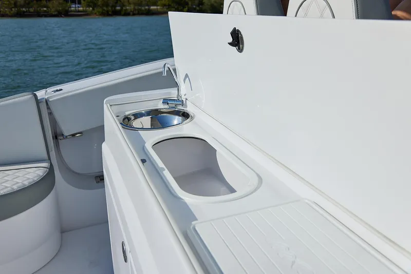 Slide: The Image of Luxury sink area on 2021 Midnight Express 43' Open boat, featuring sleek design. - 14