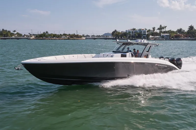 Slide: The Image of 2021 Midnight Express 43' Open boat cruising on a sunny day. - 2