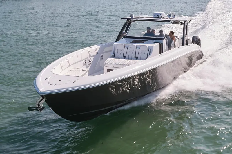 Slide: The Image of 2021 Midnight Express 43' Open boat cruising on water with passengers onboard. - 3