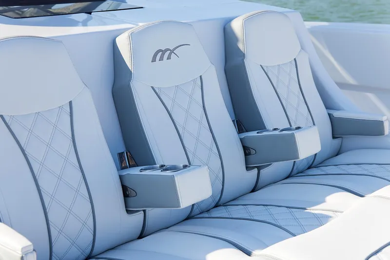 Slide: The Image of Luxurious seating on 2021 Midnight Express 43' Open boat with elegant stitching and cup holders. - 9