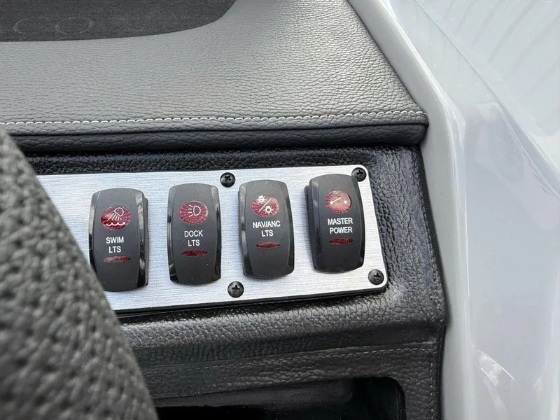 Slide: The Image of Control panel of 2025 Godfrey Monaco 235 SFL boat with labeled switches. - 17