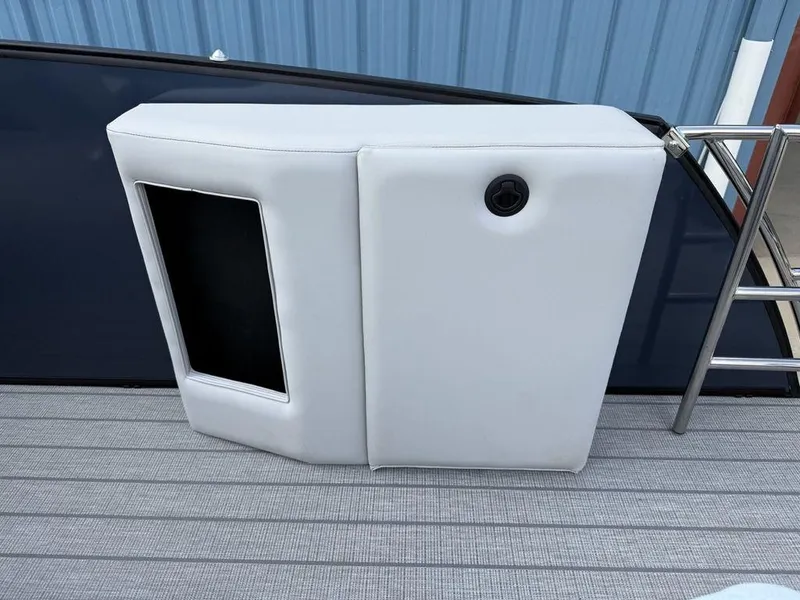 Slide: The Image of 2025 Godfrey Monaco 235 SFL iMPACT boat interior detail with white upholstery and ladder. - 19