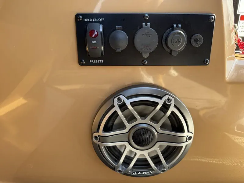 Slide: The Image of Control panel and speaker on a 2025 Godfrey Monaco 235 SFL iMPACT Package boat. - 12