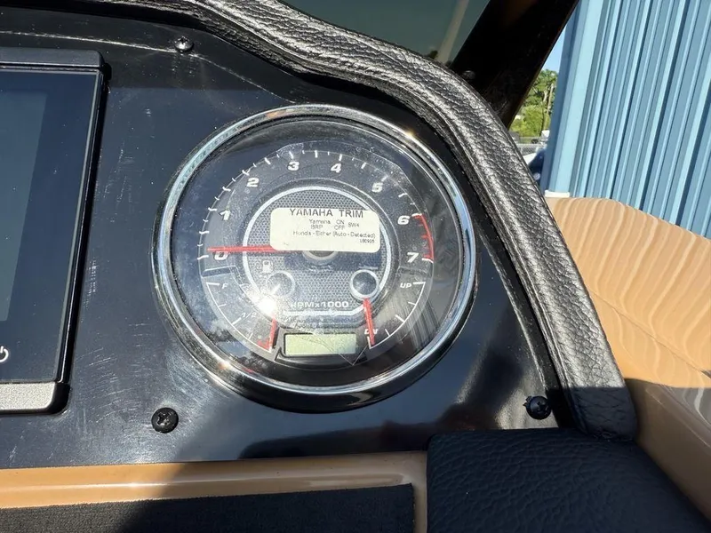 Slide: The Image of Close-up of a 2025 Godfrey Monaco 235 SFL iMPACT Package dashboard gauge. - 14