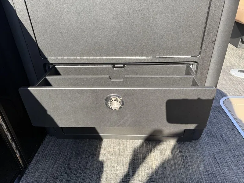 Slide: The Image of Storage compartment on 2025 Godfrey Monaco 235 SFL iMPACT pontoon boat, open drawer view. - 18