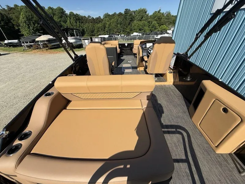 Slide: The Image of Luxurious interior of 2025 Godfrey Monaco 235 SFL pontoon boat with tan seating. - 26
