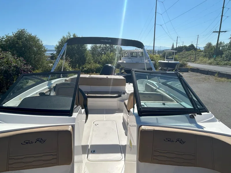 Slide: The Image of 2021 Sea Ray 21 SPX OB boat with open cockpit, parked outdoors on a sunny day. - 4