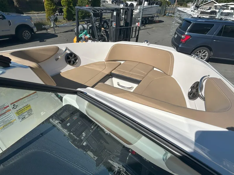 Slide: The Image of 2021 Sea Ray 21 SPX OB boat interior with tan seating and speakers. - 5