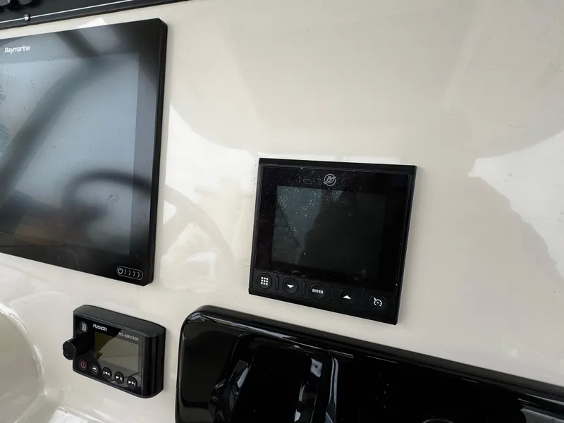Slide: The Image of Control panel of 2020 Boston Whaler 280 Outrage boat with electronic displays. - 23