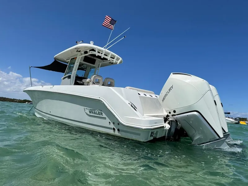Slide: The Image of 2020 Boston Whaler 280 Outrage boat with Mercury engines on clear water. - 3