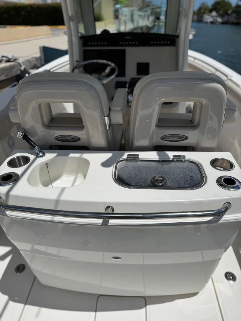 Slide: The Image of 2020 Boston Whaler 280 Outrage boat interior with dual seats and console. - 31