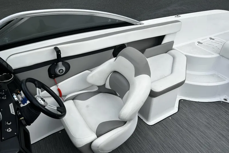 Slide: The Image of 2021 Four Winns HD2 OB boat interior with steering wheel and seating. - 15