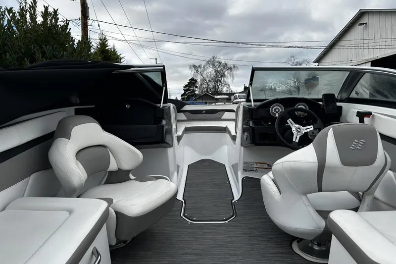 Slide: The Image of 2021 Four Winns HD2 OB boat interior with modern seating and steering wheel. - 22