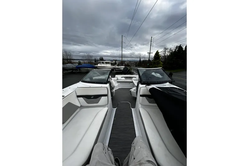 Slide: The Image of 2021 Four Winns HD2 OB boat interior with overcast sky in the background. - 24