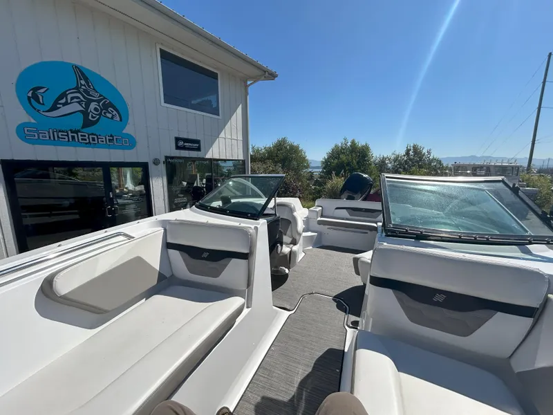 Slide: The Image of 2021 Four Winns HD2 OB boat interior at Salish Boat Co. dealership under clear blue sky. - 8