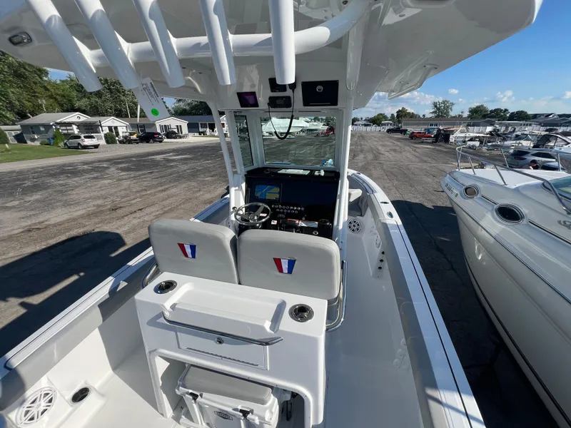Slide: The Image of 2026 Wellcraft 243 Fisherman boat interior with modern console and seating. - 8