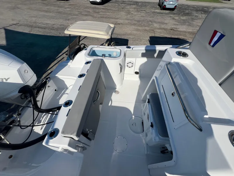 Slide: The Image of 2026 Wellcraft 243 Fisherman boat interior with seating and storage features. - 9