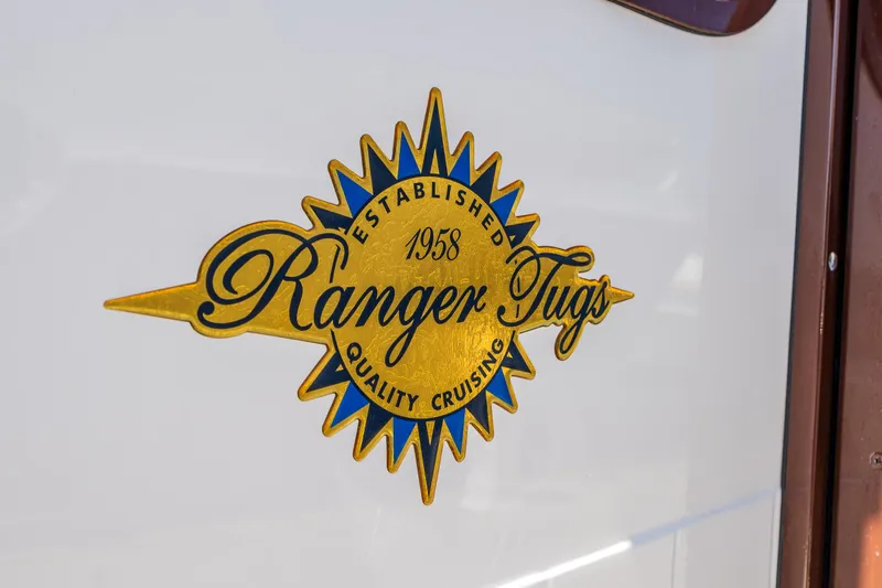 Slide: The Image of Ranger Tugs logo on 2021 R-31 CB boat, emphasizing quality cruising since 1958. - 16