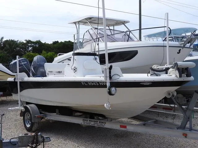 The Image of 2009 NauticStar 1810 Nautic Bay boat on trailer, parked outdoors. - 1