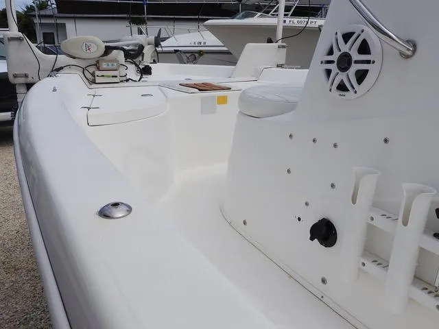 Slide: The Image of 2009 NauticStar 1810 Nautic Bay boat interior with seating and fishing rod holders. - 10