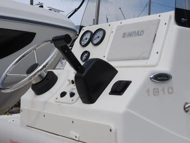 Slide: The Image of 2009 NauticStar 1810 Nautic Bay boat console with steering wheel and gauges. - 8