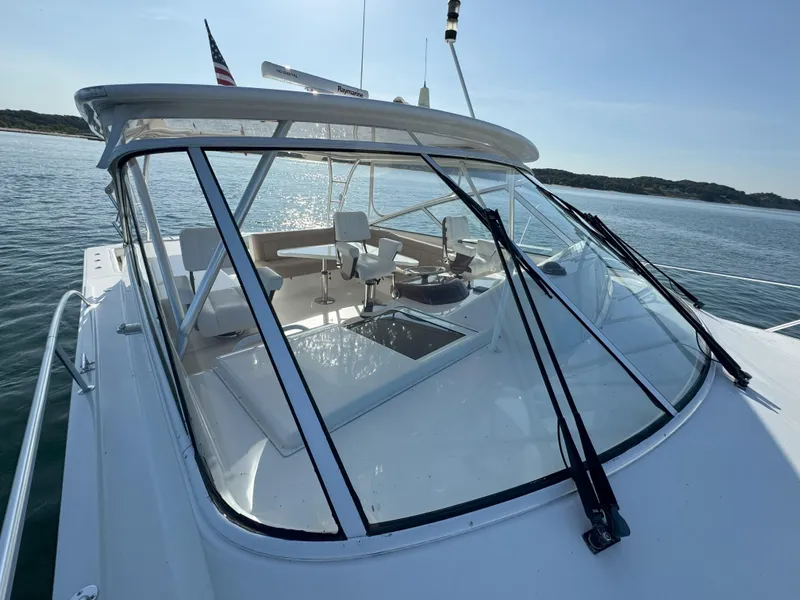 Slide: The Image of 2007 Viking 52 Open yacht on calm water, featuring sleek design and spacious cockpit. - 13