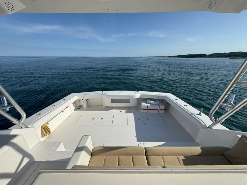 Slide: The Image of 2007 Viking 52 Open yacht deck overlooking calm ocean waters. - 14