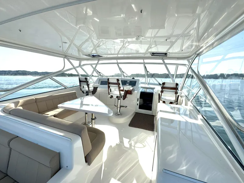 Slide: The Image of Luxurious interior of 2007 Viking 52 Open yacht with seating and helm. - 18