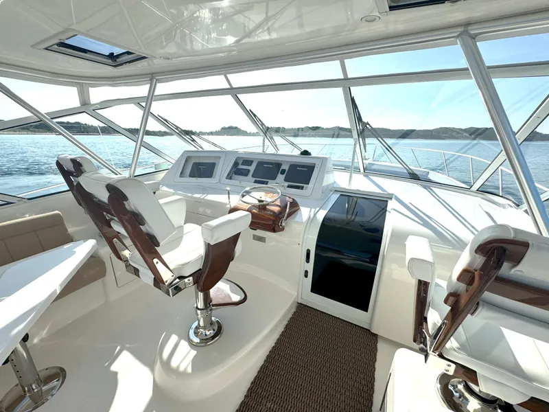 Slide: The Image of Luxurious 2007 Viking 52 Open yacht helm with modern controls and panoramic ocean view. - 23