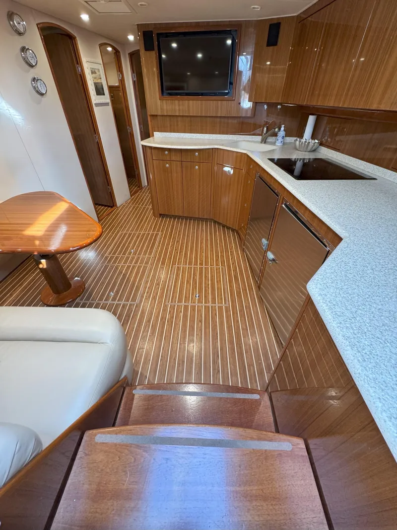 Slide: The Image of Luxurious interior of a 2007 Viking 52 Open yacht with wood finishes and modern amenities. - 32