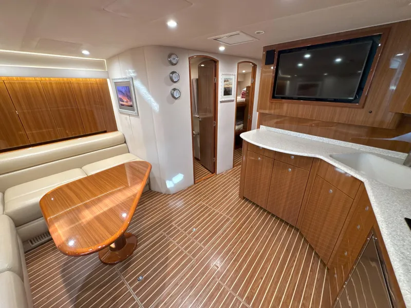 Slide: The Image of Luxurious interior of 2007 Viking 52 Open yacht with wood finishes and modern amenities. - 34