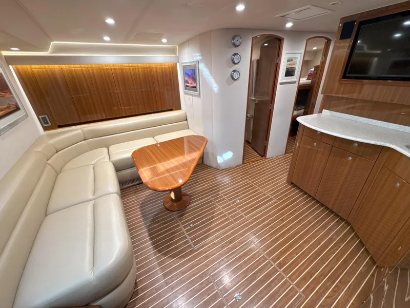 Slide: The Image of Luxurious interior of 2007 Viking 52 Open yacht with leather seating and wooden accents. - 35