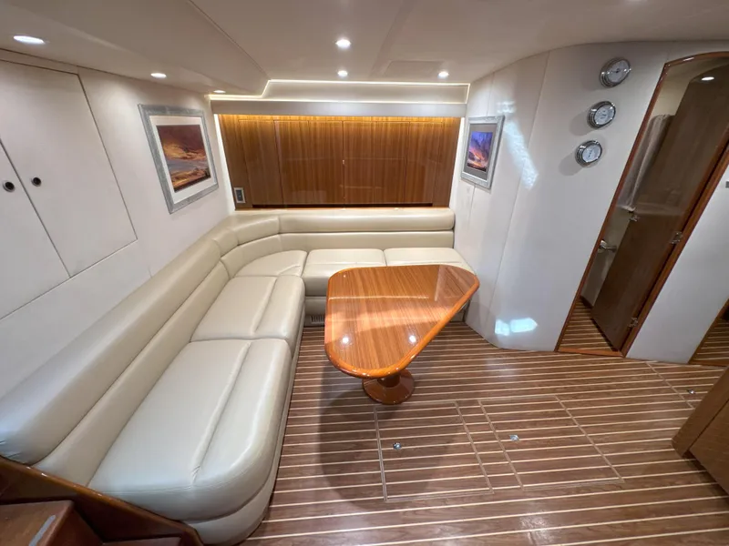 Slide: The Image of Luxurious interior of 2007 Viking 52 Open yacht with leather seating and wooden table. - 36