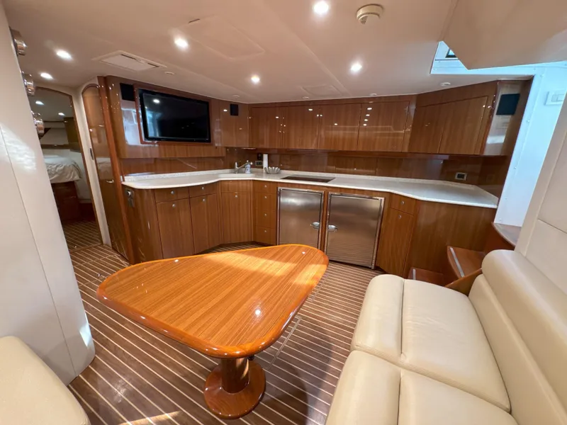 Slide: The Image of Luxurious interior of a 2007 Viking 52 Open yacht with wood finishes and modern amenities. - 39