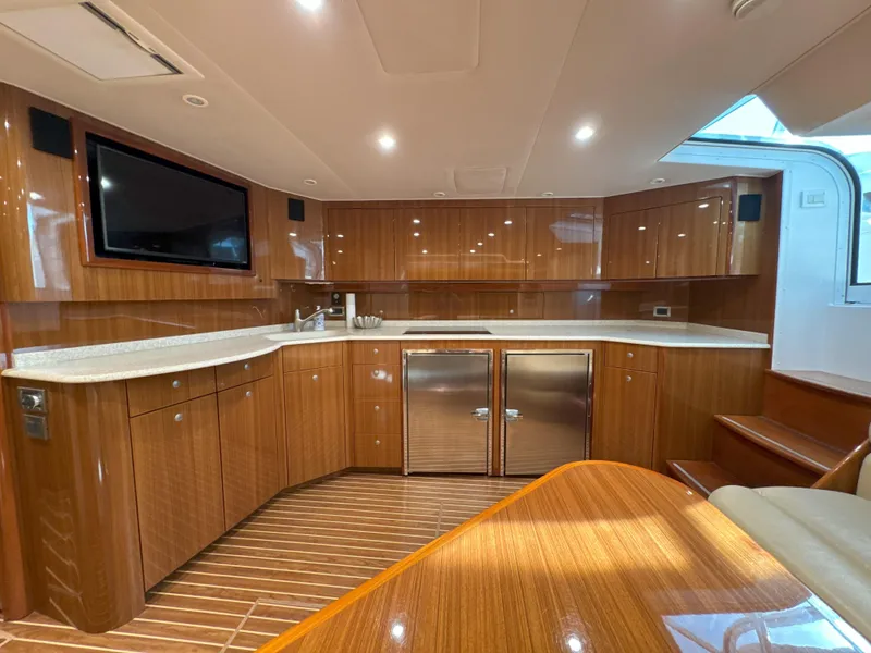 Slide: The Image of Luxurious 2007 Viking 52 Open yacht interior with modern kitchen and wooden cabinetry. - 40