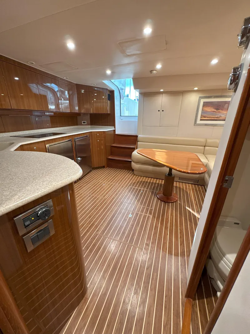 Slide: The Image of Luxurious interior of 2007 Viking 52 Open yacht with wood flooring and modern amenities. - 41