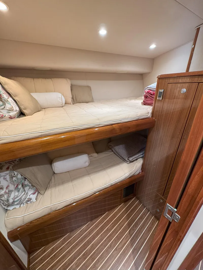 Slide: The Image of Cozy cabin with bunk beds in a 2007 Viking 52 Open yacht. - 47