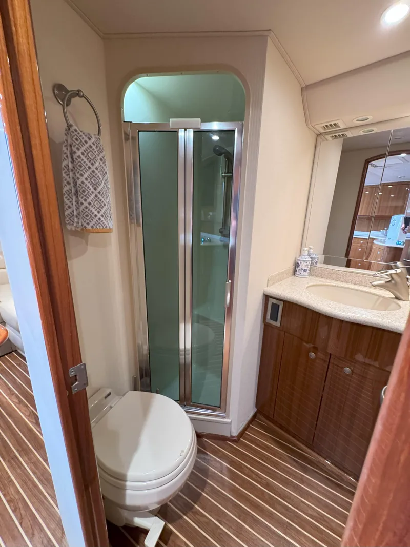 Slide: The Image of Bathroom interior of 2007 Viking 52 Open yacht with shower, toilet, and sink. - 48