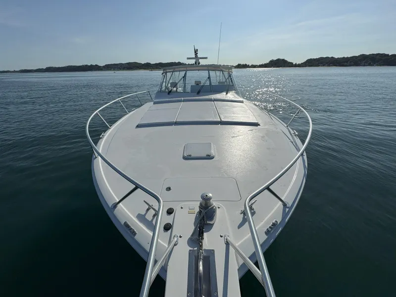 Slide: The Image of 2007 Viking 52 Open yacht on calm water, showcasing sleek deck design. - 9