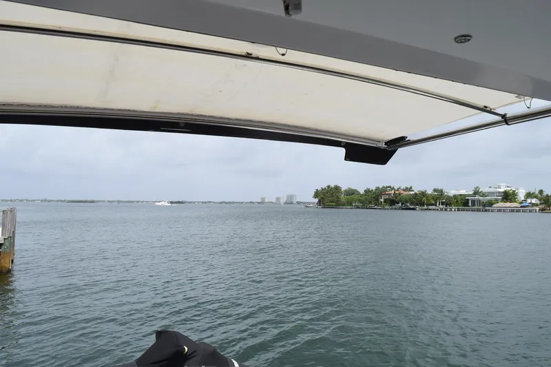 Slide: The Image of View from 2018 Cruisers Yachts 45 Cantius, overlooking calm waters and distant shoreline. - 10