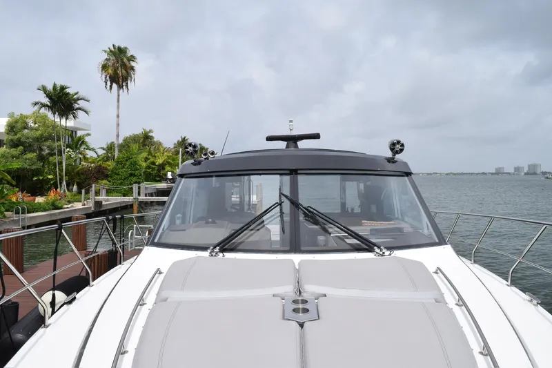 Slide: The Image of 2018 Cruisers Yachts 45 Cantius docked by tropical waterfront. - 11