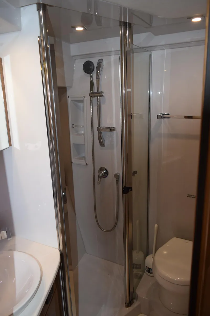 Slide: The Image of Luxurious bathroom in 2018 Cruisers Yachts 45 Cantius with modern shower and toilet. - 17